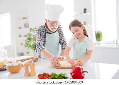 Photo Of Little Girl Granddaughter Spending Time With Aged Chef Grandpa Forming Dough For Family Pizza Recipe Baking Cooking Together Weekend Home Kitchen Indoors