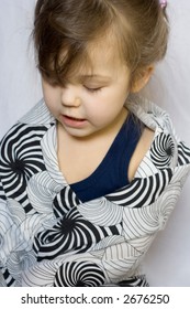 Photo Of Little Girl Playing With Too Big Clothes