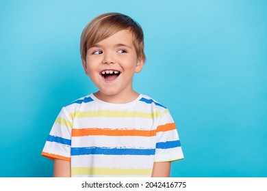 Photo of little impressed blond boy look empty space wear white t-shirt isolated on blue color background - Shutterstock ID 2042416775
