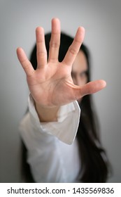 Photo of Long black hair asian woman rises her hand up to stop something - Shutterstock ID 1435569836