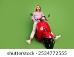 Photo of lovely adorable girl wear trendy purple clothes riding vespa isolated on green color background