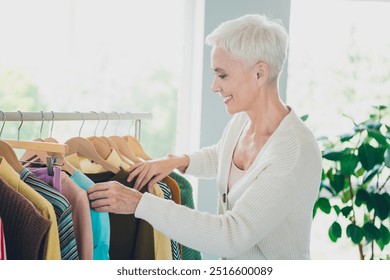 Photo of lovely charming senior woman wear trendy cardigan choose clothes wardrobe home house indoors - Powered by Shutterstock