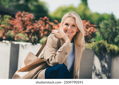 Photo of lovely cute dreamy pretty woman dressed trendy clothes walking enjoying sunny autumn weather day - Powered by Shutterstock