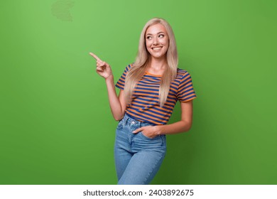 Photo of lovely cute girl wear stylish clothes arm direct empty space low price product store market isolated on green color background - Powered by Shutterstock