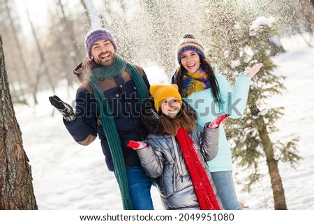 Photo of lovely family happy positive smile rejoice fly air fall snow frost winter vacation trip walk park