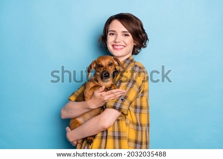 Photo of lovely girl dachshund owner enjoy time together wear checkered shirt isolated blue color background