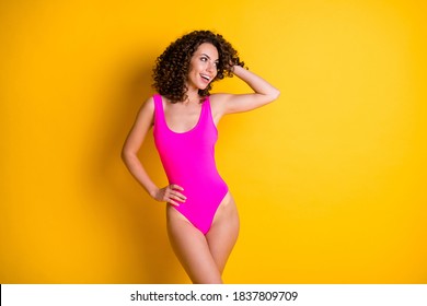 Photo of lovely girlish charming wavy hairdo lady seaside bay watch life guard sea ocean water waves brave security wear pink swimsuit isolated bright vivid shine yellow color background