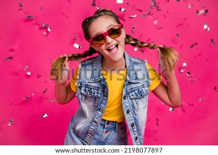 Photo of lovely little blond girl dance wear glasses t-shirt jeans vest isolated on vibrant color background