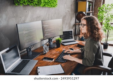 Photo of lovely nice successful woman coder hacker sitting working armchair comfortable workspace workstation indoors