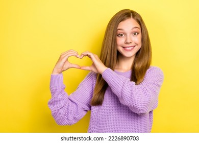 Photo of lovely pretty cute lady wear stylish violet outfit arms fingers make heart figure empty space isolated on yellow color background - Shutterstock ID 2226890703