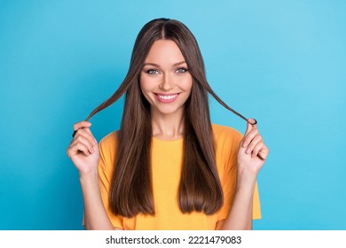 Photo Of Lovely Pretty Sweet Gentle Lady Show Toothy Bright White Smile Hand Arm Touch Strand Hair Isolated On Blue Color Background