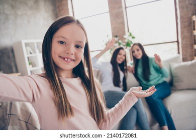 Photo Of Lovely School Girl Shooting Selfie Video Call Demonstrate Moomy Siblings Relationship Relax Couch Indoors