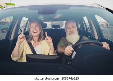Photo of lovely senior married couple have fun listen music ride car vehicle together romantic trip outdoors - Powered by Shutterstock