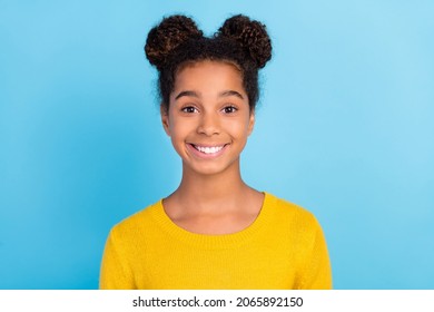 Photo of lovely small girl wear yellow sweater isolated on blue color background