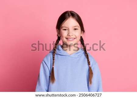 Image, Stock Photo Preteen girl in hoodie standing near green trees