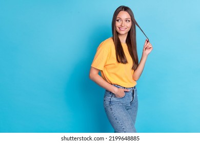 Photo Of Lovely Sweet Lady Wear Yellow Clothes Outfit Arm Touch Strand Hair Interested Look Empty Space Isolated On Blue Color Background