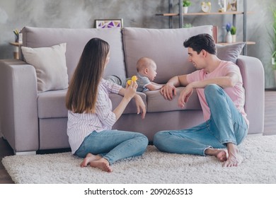 Photo of lovers couple mommy hold duck toy kid cry sofa wear casual outfit in comfortable apartment home indoors
