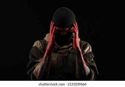 Photo Of A Man In A Military Uniform And Balaclava With A Bloody Face And Hands Up To The Elbow In Blood On A Black Background