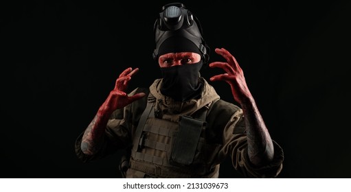 Photo Of A Man In A Military Uniform And Balaclava With A Bloody Face And Hands Up To The Elbow In Blood On A Black Background