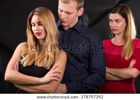 Photo of man with mistress and his betrayed wife