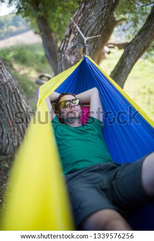 Similar – After this Photocase shock, I have to take a nap in the hammock.