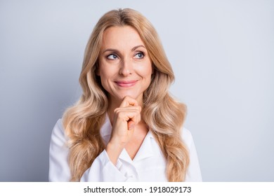 Photo Of Mature Attractive Happy Smiling Thoughtful Clever Woman Doctor Thinking Isolated On Grey Color Background