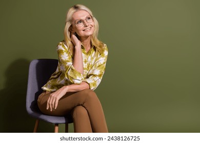 Photo of mature model business woman touch neck look empty space sitting chair deep thinking at office isolated on khaki color background - Powered by Shutterstock