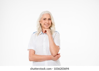 Photo Of Mature Old Happy Woman Standing Isolated Over White Background Looking Camera.