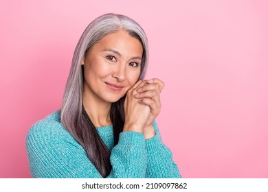 Photo of mature peaceful woman with perfect aged skin flawless skincare routine isolated on pink color background