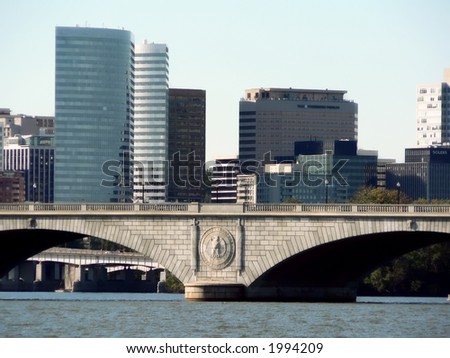 photo of the Memorial Bridge of Washington, D.C. with the skyline o Roslyn, VA in the background