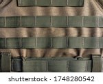 Photo of a military armor vest molle system closeup view.