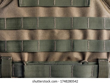 Photo of a military armor vest molle system closeup view.