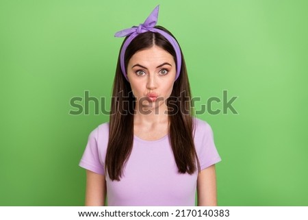 Photo of millennial brunette lady blow kiss wear violet t-shirt band isolated on green color background