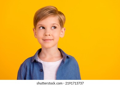 Photo of minded creative boy look interested empty space hmm deep isolated on yellow color background - Shutterstock ID 2191713737