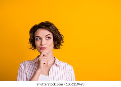 Photo of minded girl look up copyspace hand chin think wear striped white clothes isolated over yellow color background - Shutterstock ID 1806219493