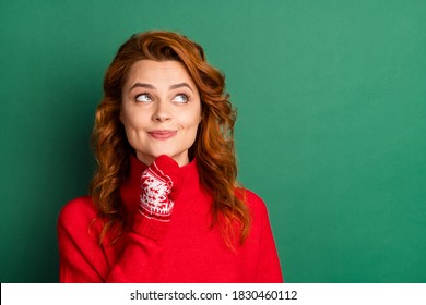 Photo of minded interested pretty girl finger chin look empty space wear red pullover mittens isolated green color background - Powered by Shutterstock