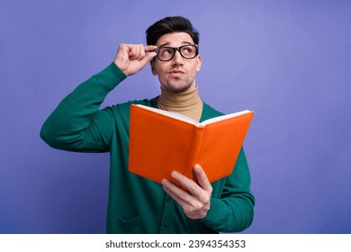 Photo of minded smart clever man wear stylish green clothes look up empty space academic courses offer isolated on purple color background - Powered by Shutterstock