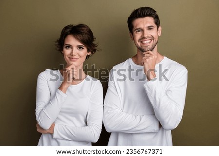 Photo of minded successful two friends colleagues wear white stylish clothes finger touch face isolated on brown color background