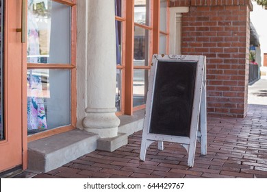 Photo Mock Up Of Blank Sandwich Style POP Advertising Chalkboard Sign Outside Storefront