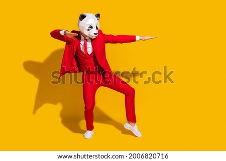 Photo of modern dancer panda guy dance move wear mask red tuxedo tie shoes isolated on yellow color background