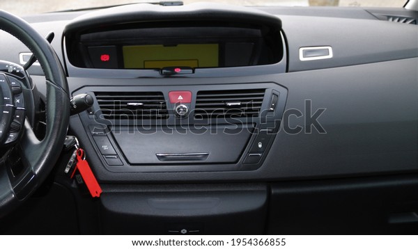 Photo of modern front\
vehicle dashboard.