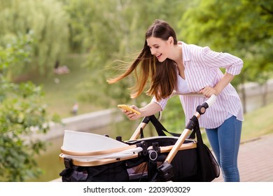 Photo Of Modern Mommy Lady Blogger Leisure Weekend Walk Make Picture Infant Son Sleep In Pram Outside