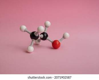 Photo Of A Molecular Atom Model Isolated On A Pink Background.