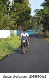  Photo Of A Motorcycle Rider Posing While Riding, Without Helmet. Location: Kerala, India Date 21-10-2020.