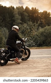 Photo Of A Motorcyclist At Sunset. Vintage Poster. 60s Style Background