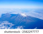  photo of Mount Kilimanjaro in Tanzania while boarding a plane departing from Kilimanjaro International Airport.