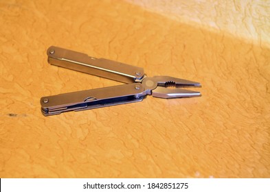 Photo Of Multitool Pliers On The Table