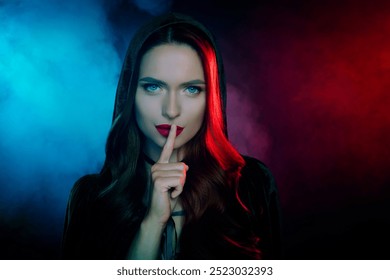 Photo of mysteriour lady warlock put fingers lips keeping secret isolated neon filter mist background