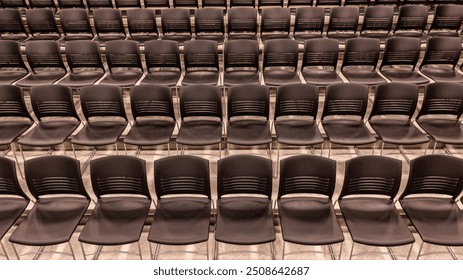 Photo of a new school theater, auditorium, large group instructional space with gray seats, chairs.	 - Powered by Shutterstock