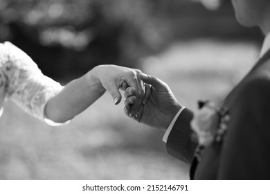 Photo Of Newlyweds' Hands During Important Moments For Them During The Wedding Day